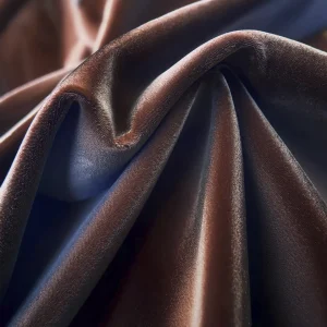 Primer plano de una tela con acabado aterciopelado, mostrando una textura suave y rica, similar al terciopelo.