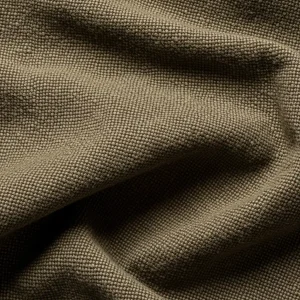 Macro de tela burda de algodón color caqui, mostrando su tejido grueso, denso y resistente. Ideal para ropa de trabajo y uniformes.